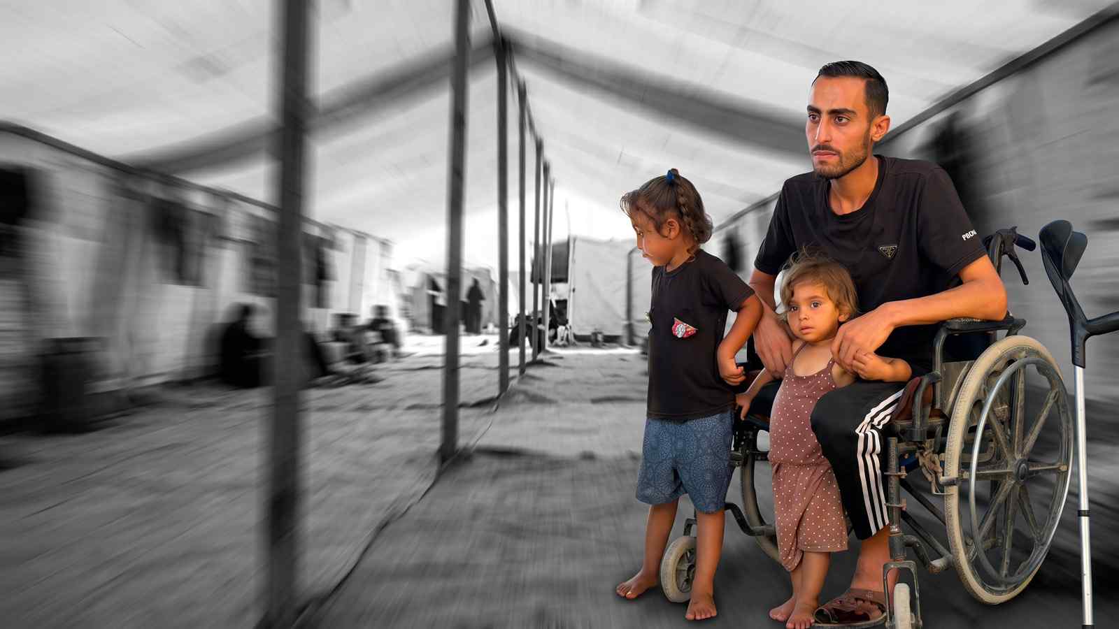 A father who lost his leg in Gaza sits in his wheelchair with his two young children beside him